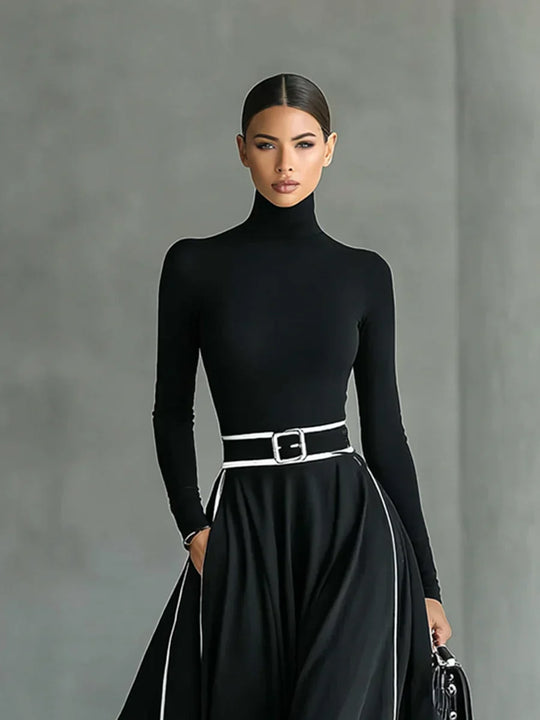 Adriana - Vestido largo negro con costuras blancas, cuello alto y cinturón ajustado