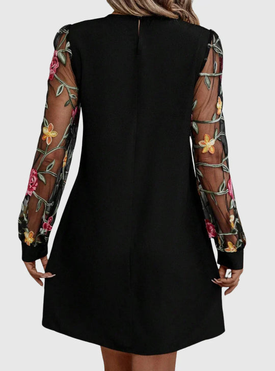 Martina - Elegante vestido con escote en V y mangas llamativas