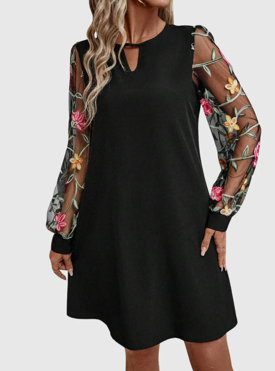 Martina - Elegante vestido con escote en V y mangas llamativas