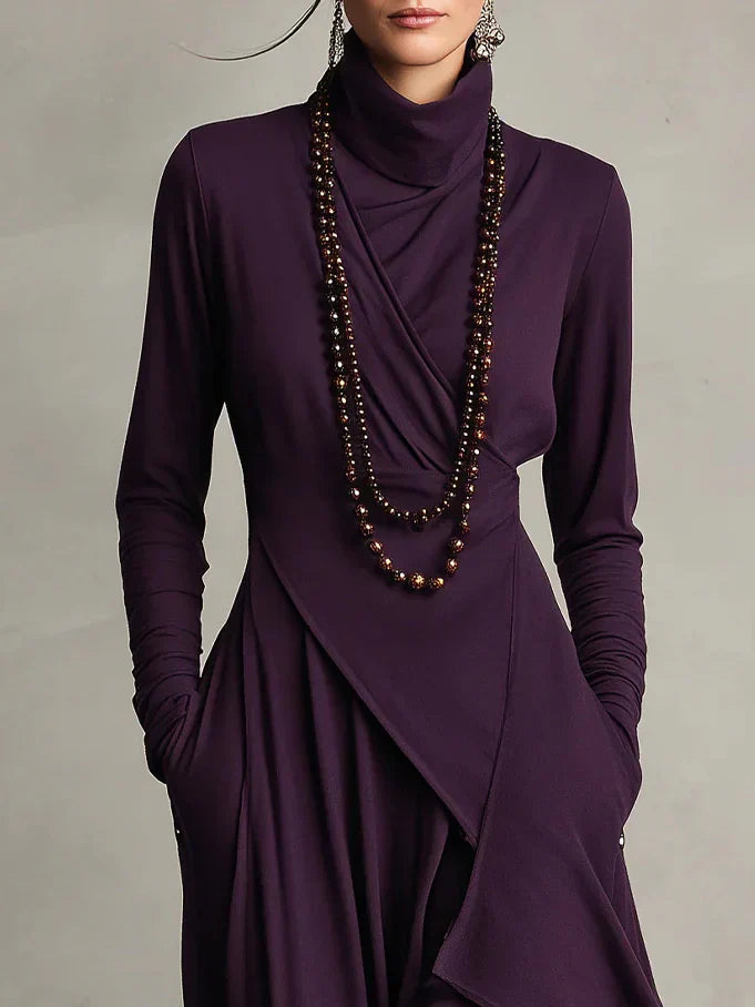 Nerea – Vestido maxi de cuello alto con diseño asimétrico